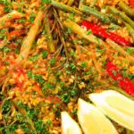 Overhead close-up mixed vegetable paella with fennel and artichokes (Vegan & Vegetarian).