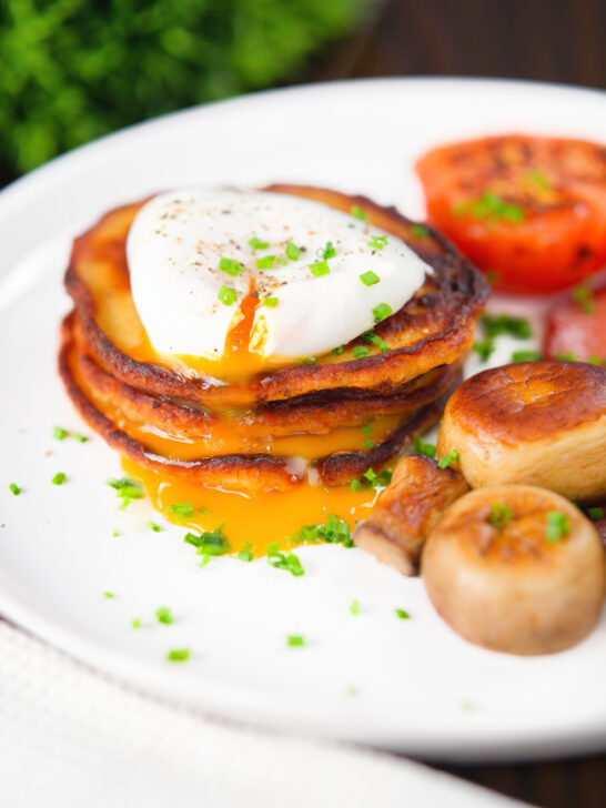 Irish boxty potato pancakes with poached egg, mushrooms and grilled tomato.