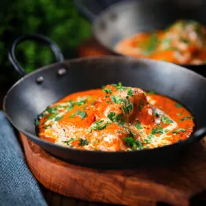 Indian butter chicken curry or murgh makhani with fresh coriander.
