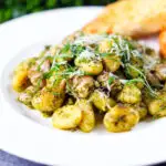 Garlic chicken and basil pesto gnocchi served with cheesy garlic bread.