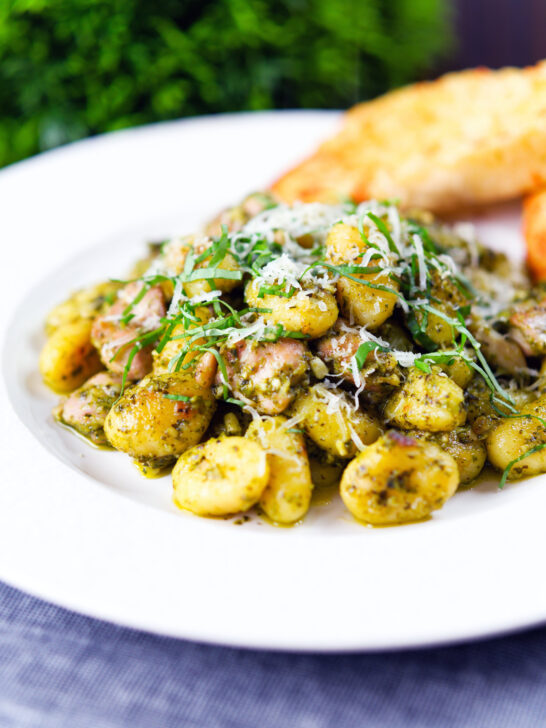 Garlic chicken and basil pesto gnocchi served with cheesy garlic bread.