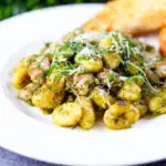 Garlic chicken and basil pesto gnocchi served with cheesy garlic bread.