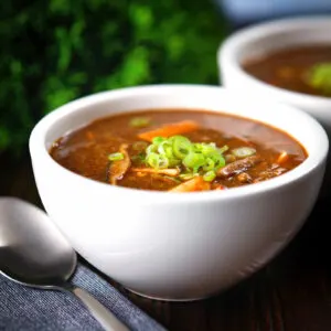 Vegetarian Chinese hot and sour soup with shiitake mushrooms and silken tofu.