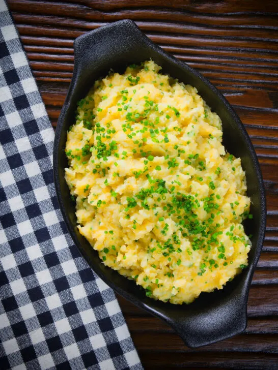 Overhead Scottish buttery swede and potato mash (clapshot) with fresh chives.