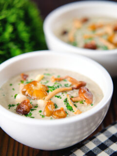 Cream of wild mushroom soup garnished with fried mushrooms.