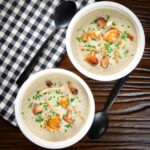Cream of "wild" mushroom soup topped with sautéed mushrooms and parsley.