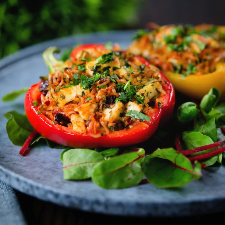 Brown rice, halloumi cheese and harissa stuffed and baked peppers.