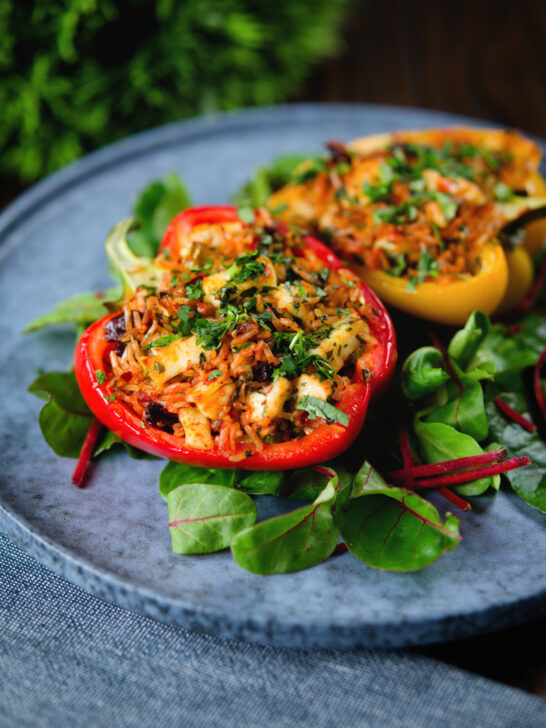 Baked stuffed peppers with halloumi cheese, brown rice, harissa pasta and raisins.