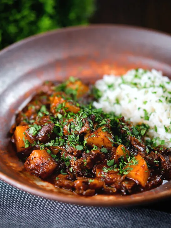 Indian-influenced potato and oxtail curry served with rice.