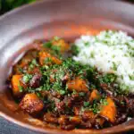 Indian-influenced potato and oxtail curry served with rice.