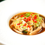 Chinese influenced spicy leftover roast chicken soup with noodles.