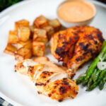 Peri peri spatchcock chicken served with roasted potatoes, asparagus and garlic mayo.