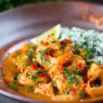 Indian-influenced prawn and mango curry in a coconut milk sauce served with herby rice.