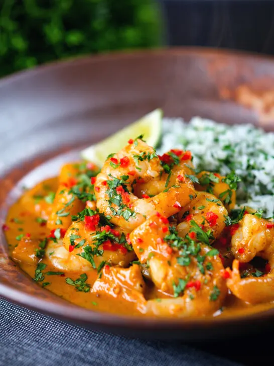 Indian-influenced prawn and mango curry in a coconut milk sauce served with herby rice.