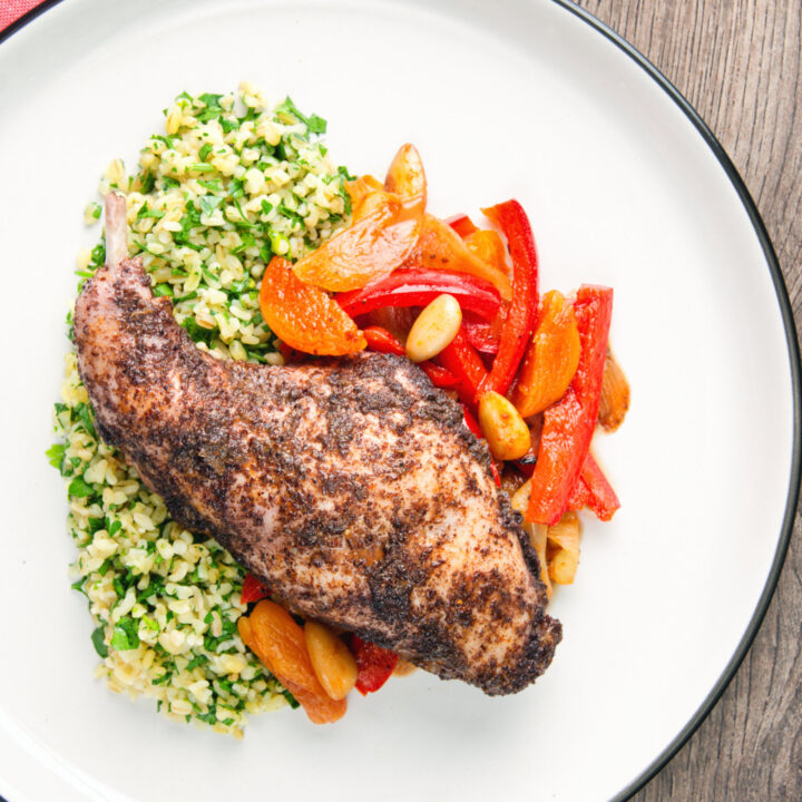 Spicy rabbit leg tagine served with herby bulgur wheat.