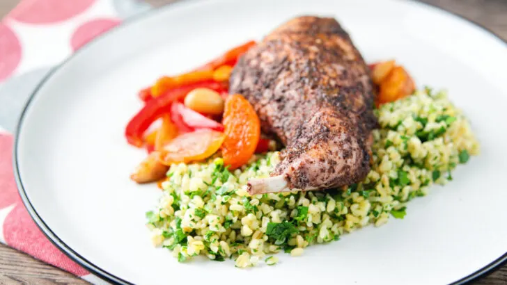 Spicy rabbit leg tagine served with herby bulgur wheat.