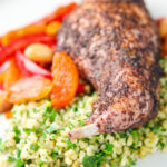 Rabbit leg tagine served with herby bulgur wheat.
