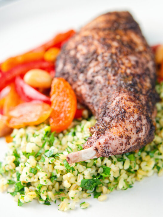 Rabbit leg tagine served with herby bulgur wheat.