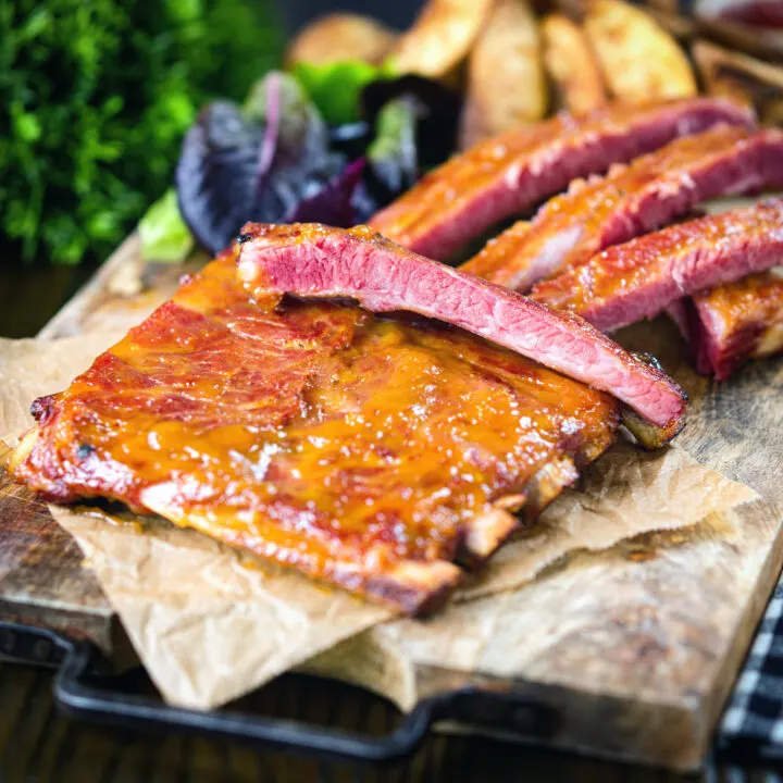 Apricot jam glazed bacon ribs served with potato wedges.