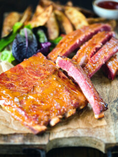 Apricot jam and mustard glazed bacon ribs served with air fryer potato wedges.