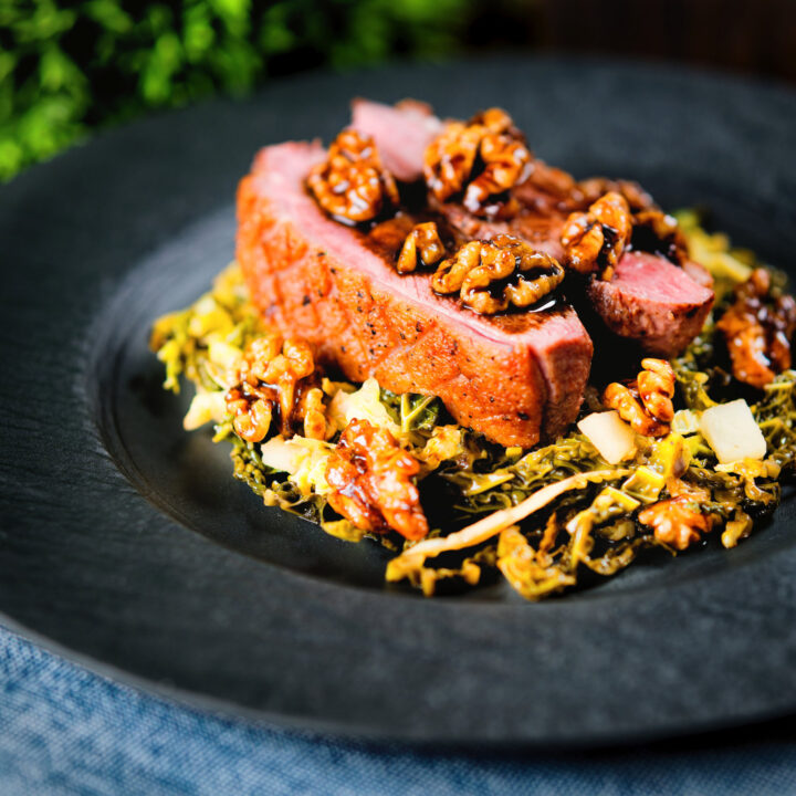 Pan fried balsamic and honey glazed duck breast with cabbage, apples and walnuts.