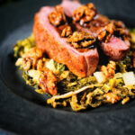 Balsamic and honey glazed duck breast with cabbage, apple and walnuts.