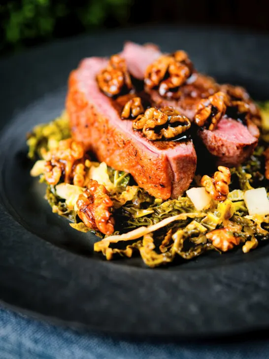 Balsamic and honey glazed duck breast with cabbage, apple and walnuts.