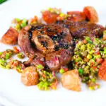 Pan-fried leg of lamb steaks served with pea "salsa" and fried new potatoes.