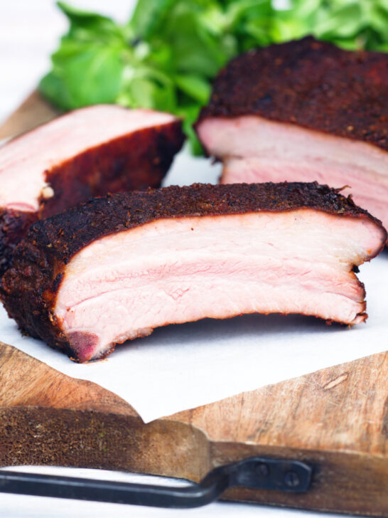 Meaty smoked BBQ pork ribs cut open to show juicy meat texture.