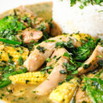 Close-up Thai green chicken curry with mangetout and baby corn.