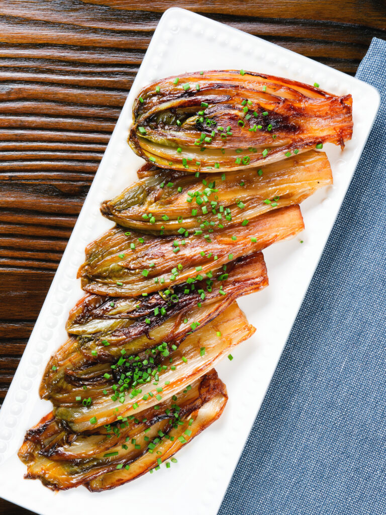 Overhead Braised White Chicory or Belgian Endive with Snipped Chives.