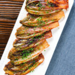 Overhead Braised White Chicory or Belgian Endive with Snipped Chives.
