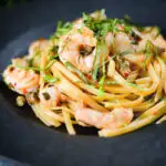 Garlic chilli prawn (shrimp) linguine with fried capers and basil.