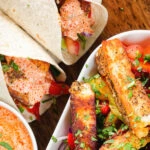 Overhead close-up of crispy halloumi cheese wraps with a harissa and yoghurt sauce.