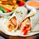 Crispy halloumi cheese and salad wraps with a harissa and yoghurt sauce.
