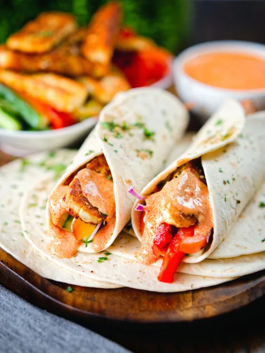 Crispy halloumi cheese and salad wraps with a harissa and yoghurt sauce.
