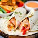 Crispy halloumi cheese and salad wraps with a harissa and yoghurt sauce.
