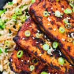 Close-up overhead honey and miso glazed tofu served with egg fried rice.