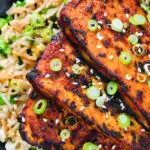 Close-up overhead honey and miso glazed tofu served with egg fried rice.