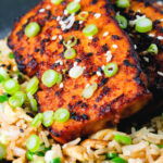 Close-up honey and miso glazed tofu served with egg fried rice.