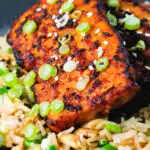 Close-up honey and miso glazed tofu served with egg fried rice.