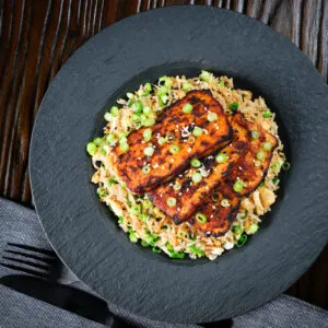 Grilled honey and miso glazed tofu served with egg fried rice.