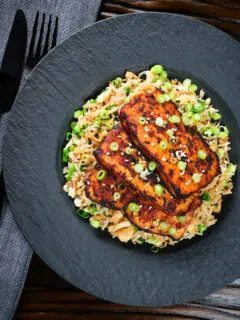 Overhead honey and miso glazed tofu served with egg fried rice.