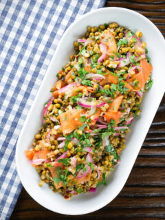 Overhead mung bean salad with Indian flavours & pickled carrot and red onion.