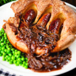 Individual toad in the hole served with peas and a rich onion gravy.