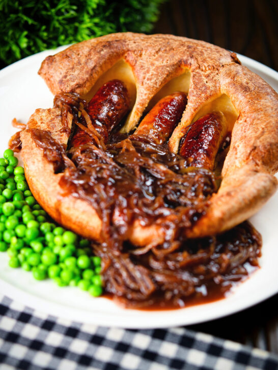 Individual toad in the hole served with peas and a rich onion gravy.