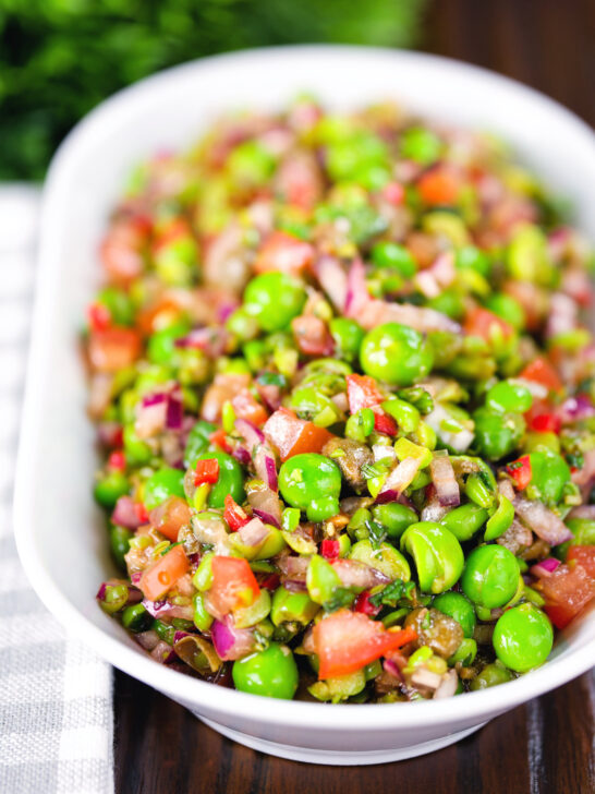 Minted pea salsa or salad with capers, tomatoes chilli and red onion.