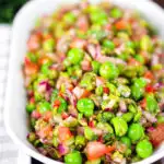 Minted pea salsa or salad with capers, tomatoes chilli and red onion.