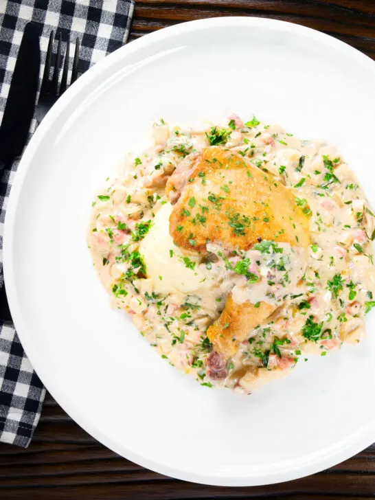 Overhead chicken Normandy in a cider and mustard sauce served with creamy mashed potatoes.