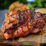 Crispy roast ham hock glazed with honey and mustard served with potato wedges and cider sauce.